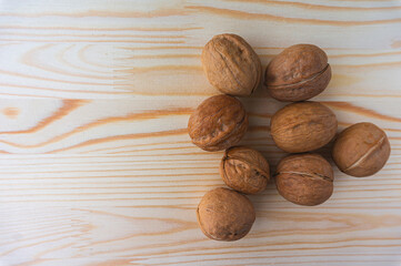 Walnut on wooden background 