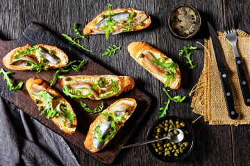 anchovy butter sandwiches with capers and arugula