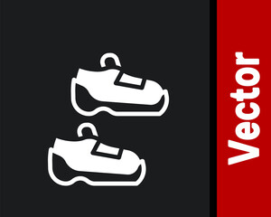 White Fitness sneakers shoes for training, running icon isolated on black background. Sport shoes. Vector.