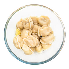 top view of boiled Pelmeni (russian dumplings filled with minced meat) with butter in glass bowl isolated on white background