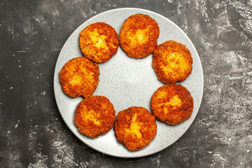 top view tasty fried cutlets inside plate on dark background meat rissole dish