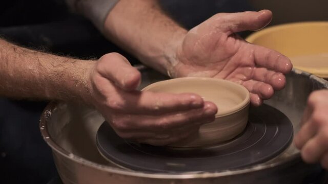 The process of preparing tableware from natural clay on a potter's machine   