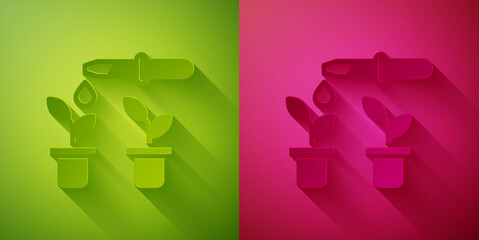 Paper cut Drop of water drops from pipette on plant icon isolated on green and pink background. Medical or agricultural experiments. Fertilizers and pesticides. Paper art style. Vector.