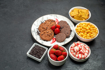 front view delicious choco biscuits with snacks on dark background photo sweet cookie