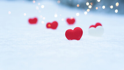 heart on snow, concept valentine's day holiday background, bokeh from light garlands new year