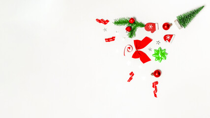 Xmas background white. Stocking, gifts, winter tree, ribbon and bow in Christmas composition on white background for greeting card. Flat lay, top view, copy space.