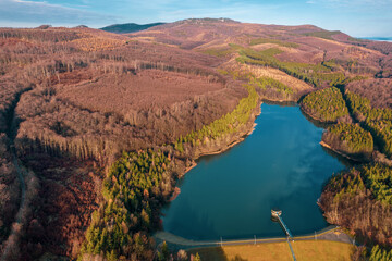 Fototapeta premium Hungary - Matra mountains with Csori-reti water reservoir from drone view