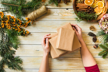 Woman demonstrates the creation of Christmas eco gifts