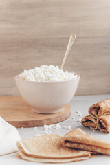Fresh homemade crumbly cottage cheese in a large bowl