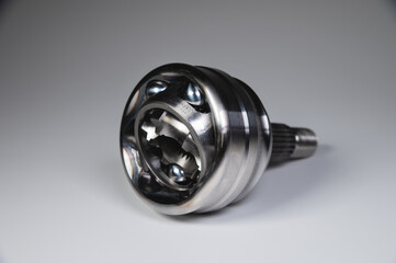 New CV joint on a gray background. Car suspension parts