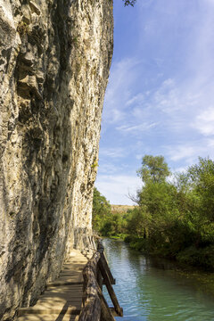 Natural park called Iskar Panega along the Zlatna Panega River near Lukovit, Bulgaria. Wooden bridge over the river.
