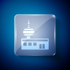 White Airport control tower icon isolated on blue background. Square glass panels. Vector.
