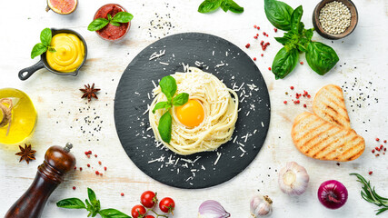 Paste. carbonara with egg yolk. Top view. Italian food. Free space for your text.
