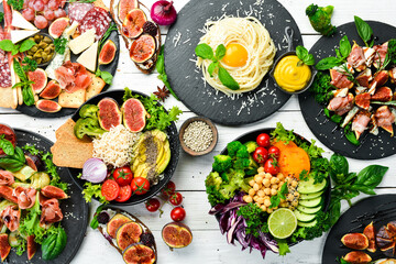 Dishes background. Set of dishes on the dining table. Food. Traditional cuisines of the world. Top view. Free space for your text.