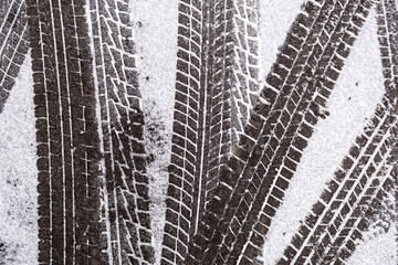 Car tire tracks in fresh snow