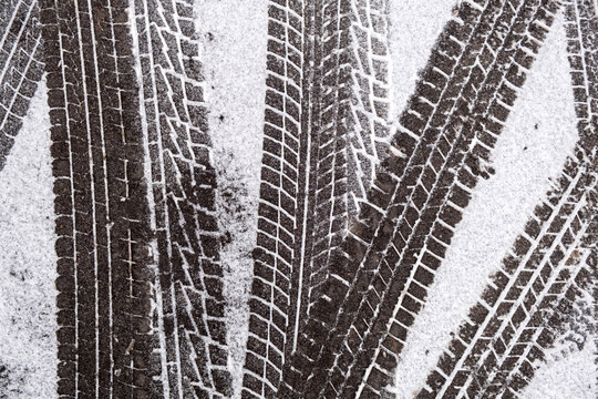 Car tire tracks in fresh snow