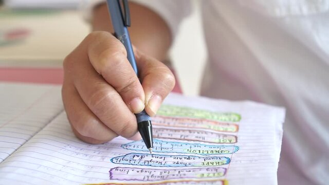 Hands student writing and testing English language in exercise, taking fill in notebook exam at school test room, evaluation measurement in education
