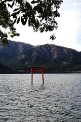 apanese red big torii gate of Kuzuryu Jinja shrine hongu besides Ashino lake at Hakone Kanagawa...