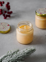 Obraz na płótnie Canvas Orange scented candles. The winter atmosphere. Space for text. Comfort and fragrance. Aromatherapy. New Year, Christmas.