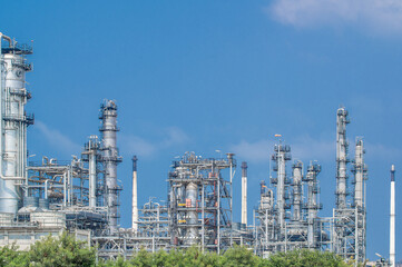 Fototapeta premium Industrial zone,The equipment of oil refining,Close-up of industrial pipelines of an oil-refinery plant,Detail of oil pipeline with valves in large oil refinery.