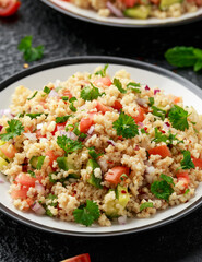 Tabbouleh salad with tomato, cucumber, red onion, bulgur and parsley. Healthy vegan food