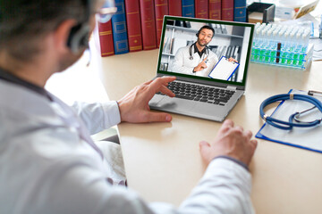 The doctor is talking with a colleague via video link.