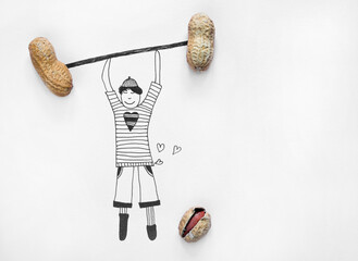 An illustration of a boy lifting dumbbells from real peanuts