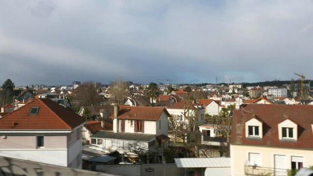 Suburban Neighborhood Town Row Houses. POV View out  of RER Train Window. Paris Suburbs near Railway. Ile-de-France Europe. 2020. 2x Slow motion 60 fps 4K