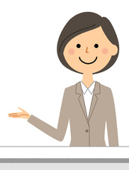 案内するスーツの女性　受付