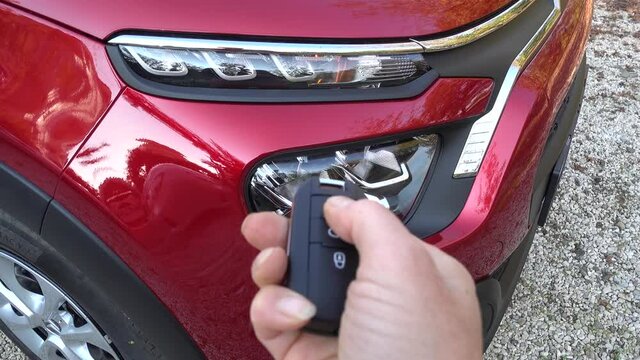 Fethiye, Turkey - 20th of December 2020: 4K Front lamp gives light when locking car with remote control key
