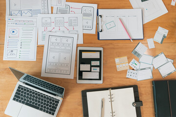 Top view of Creative flat lay UX designer working space and office supplies. Smartphone and tablet...