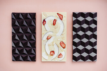 Natural handmade chocolate close-up on a bright background.