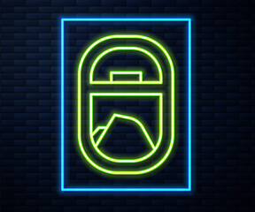 Glowing neon line Airplane window icon isolated on brick wall background. Aircraft porthole. Vector.