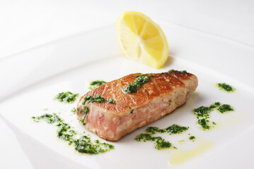 Grilled tuna steak with green sauce