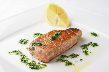 Grilled tuna steak with green sauce