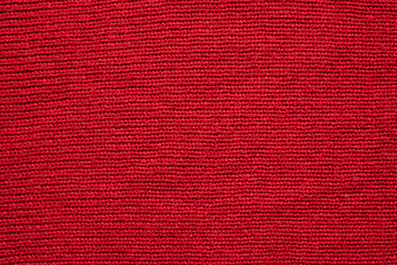 Red knitted wool texture background