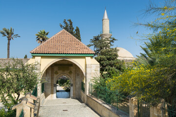 The gate of the ancient mosque Hala Sultan Tekke or the Mosque of Umm Haram near the shore of the salt lake in Cyprus in Larnaca