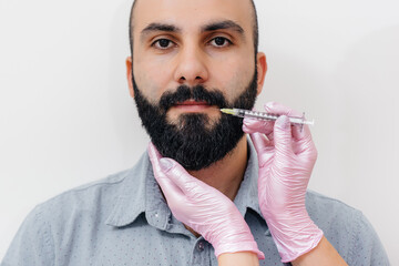 Cosmetic procedure for lip augmentation and wrinkle removal for a bearded man. Cosmetology