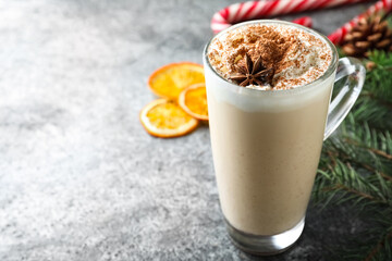 Delicious Christmas cocktail with liqueur on grey table. Space for text
