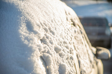 Parked car covered with snow. Transportation, winter, weather, vehicle concept.