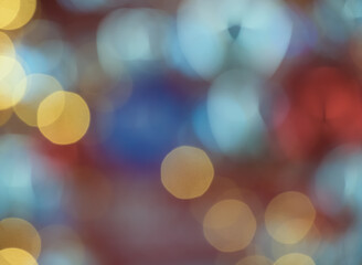 Blurry colorful Christmas bokeh lights festive background.