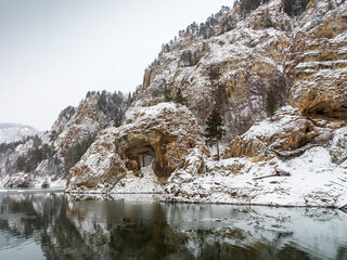Fototapeta na wymiar A lake surrounded by snow. High quality photo