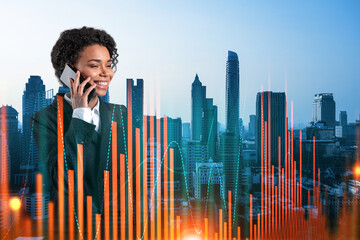 Attractive black businesswoman trader processing conference call to forecast the capital market...
