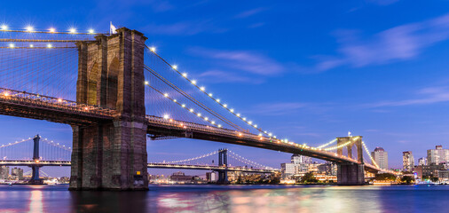 Brooklyn Bridge at sunset view. Manhattan.