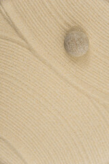 Zen sand garden meditation stone background with copy space. Stones and lines drawing in sand for relaxation. Concept of harmony, balance and meditation, spa, massage, relax. Set Sail Champagne color