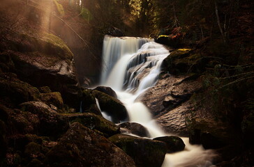 Triberg waterfall in black forest during sunset, last sunrays
