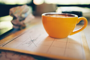 Tourist hold pen and planning vacation with calendar and map.
