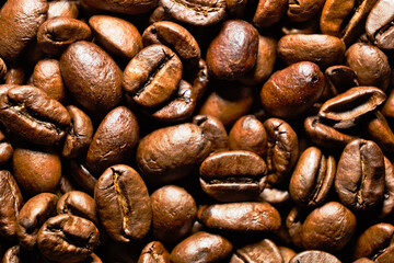 brown fresh roasted coffee beans, background, close up