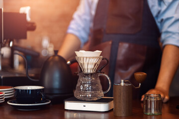 Measuring coffee drip with glass mug