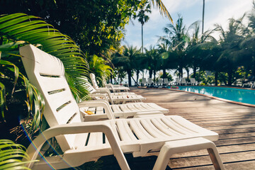 Lounge chairs near the pool at the hotel.